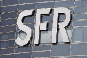 The logo of French telecom operator SFR is seen on a building in the financial district of le Defense at Nanterre, west of Paris